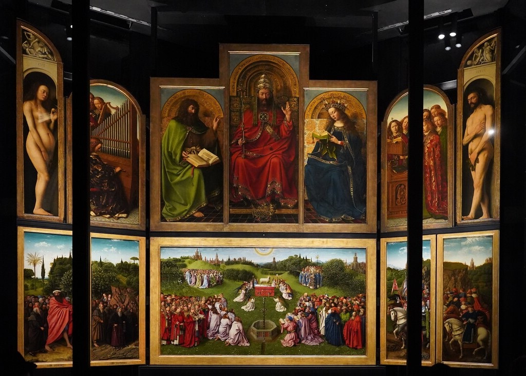 The Ghent Altarpiece, an extraordinary example of Early Netherlandish painting, with detailed depictions of biblical figures, rich landscapes, and symbolic religious scenes, illustrating the virtuosity of the Van Eyck brothers.