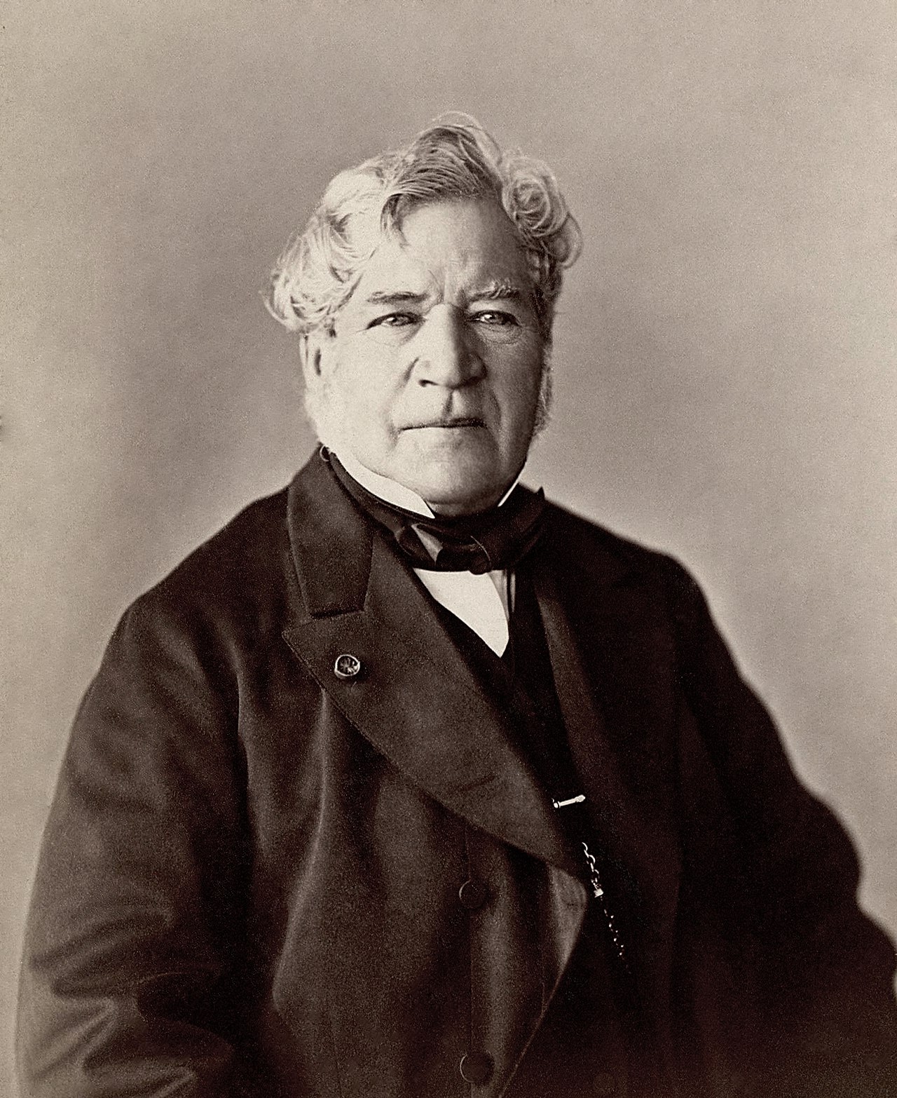 Vintage photograph of Eugène Isabey, the influential French romantic landscape painter, characterized by his intense gaze and formal attire.