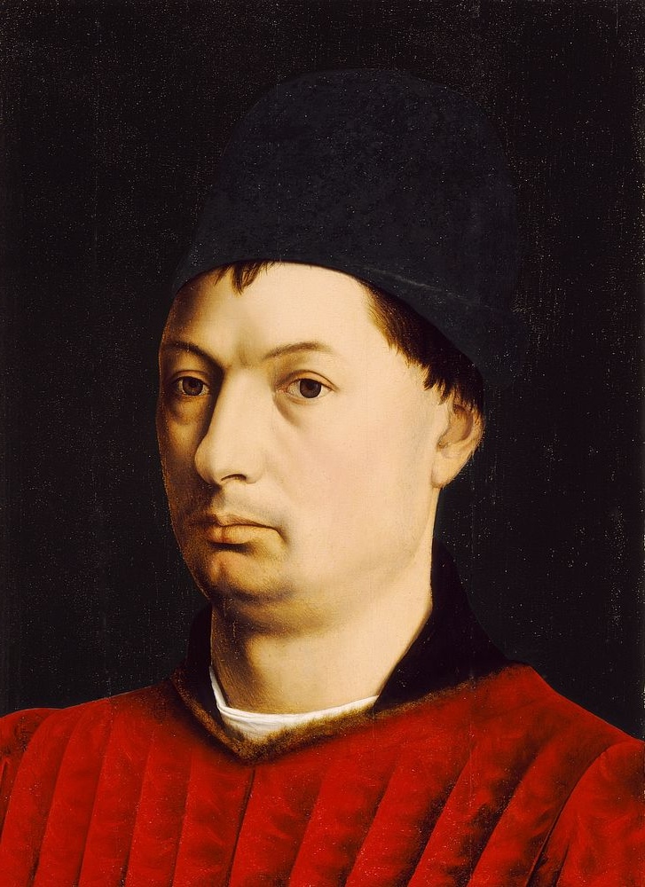 15th-century portrait by Petrus Christus, featuring a man in a red garment and blue chaperon, captured with the distinctive precision and psychological depth of Northern Renaissance portraiture.