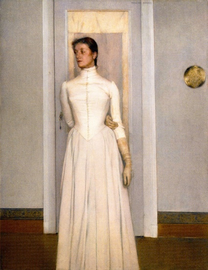 Portrait of Marguerite Khnopff (1887) by Fernand Khnopff, showcasing a woman in a white dress standing against a door frame, her pose and attire reflecting the Symbolist movement's elegance.