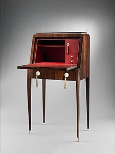 Tibattant Lady's Desk (1923) by Émile-Jacques Ruhlmann reflects the luxurious craftsmanship of the Art Deco era, blending a variety of rich materials, such as macassar ebony, ivory, and leather