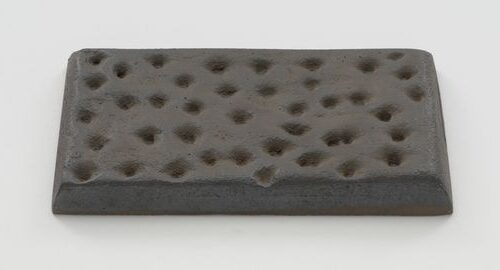 Knäckebröd (1966) reflects a playful, oversized sculpture of Swedish crispbread, rendered in soft, malleable materials