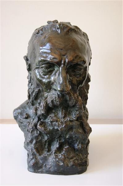 Auguste Rodin (1892) by Camille Claudel reflects a deeply personal and expressive portrayal of the renowned sculptor, capturing his intense presence and contemplative nature